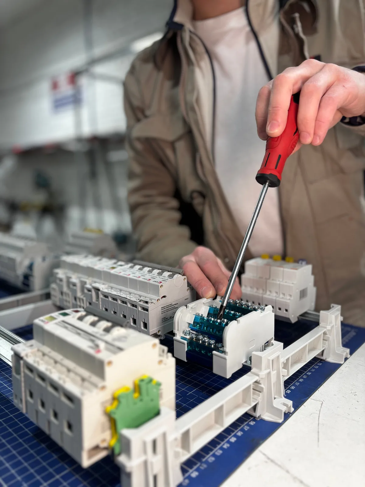 Breakers assembled on a DIN rail before installation, for licensed electrician in Salt Lake City