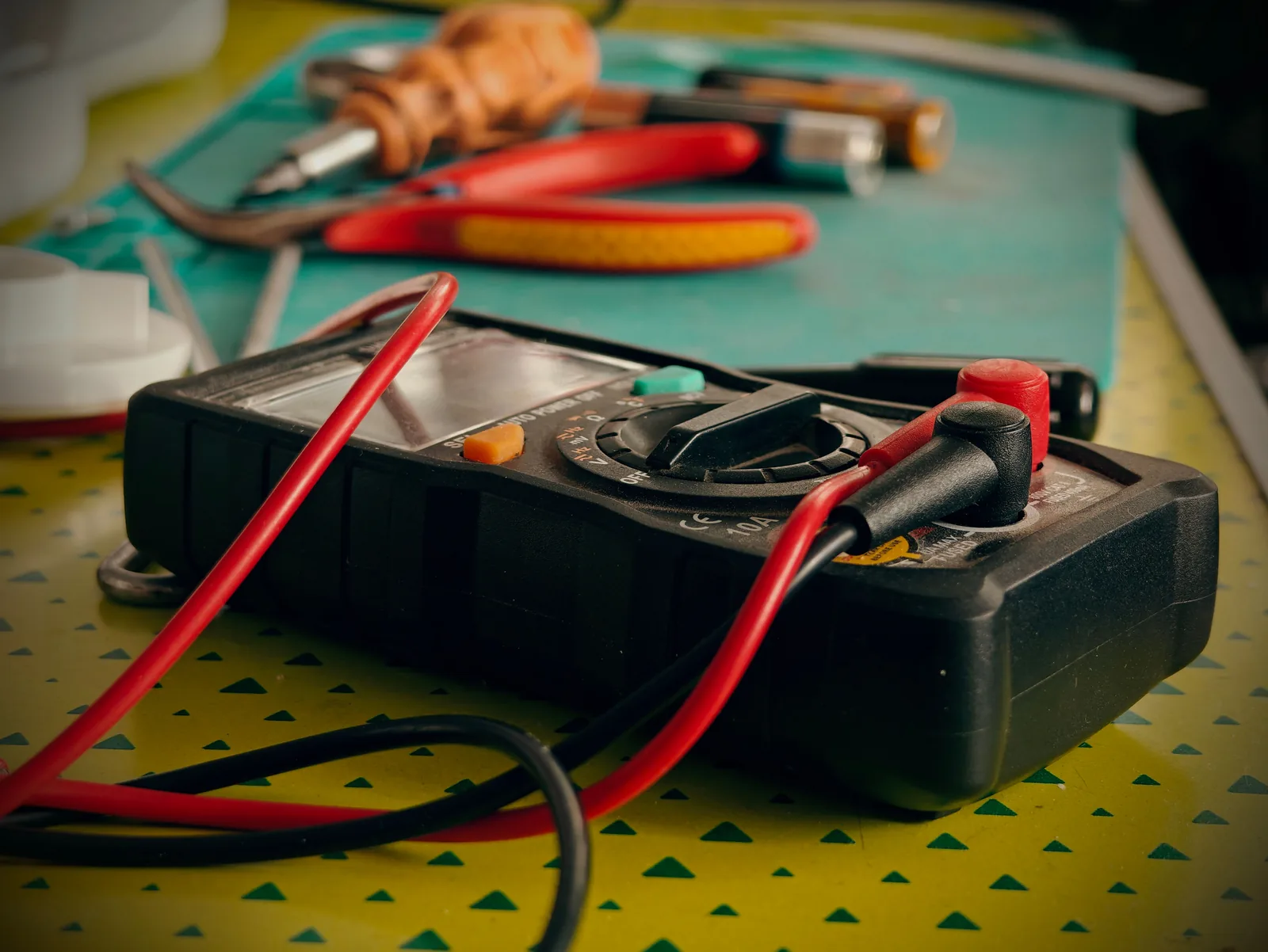 A multimeter and hand tools ready for a diagnostic visit, for electrician in Salt Lake City