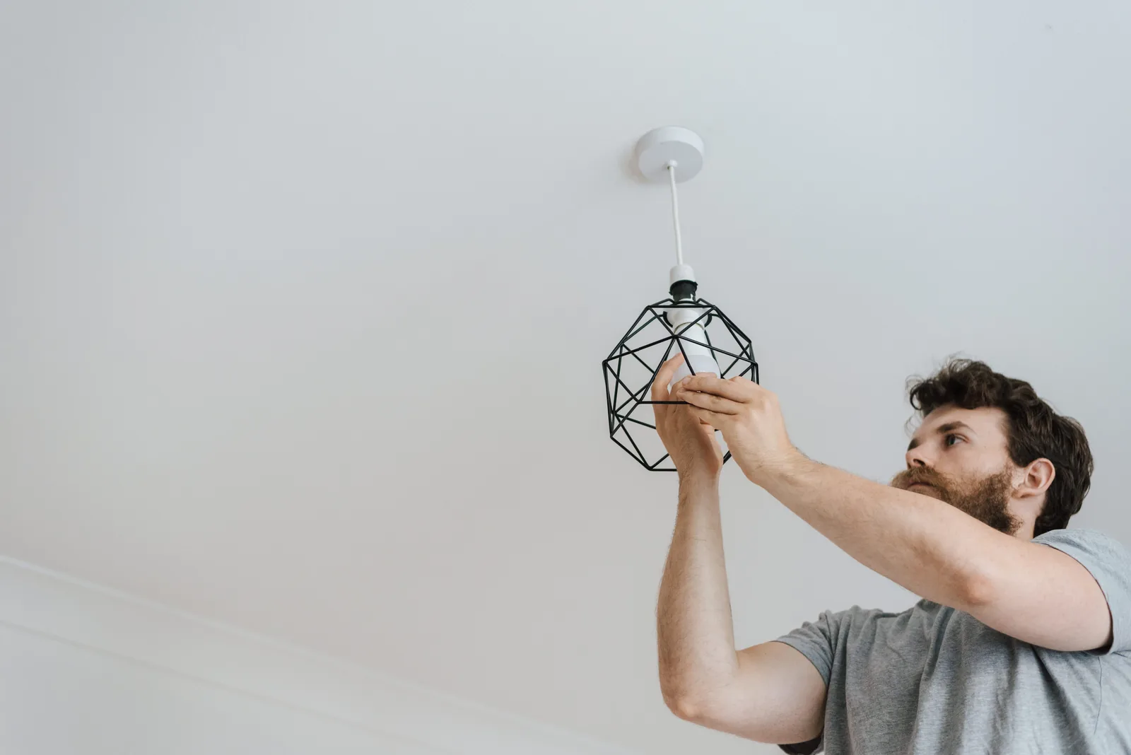 Fitting a lamp into a pendant fixture, for surge protection in Salt Lake City